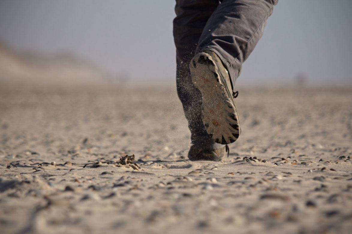 Patient walking to track step count during spine surgery recovery